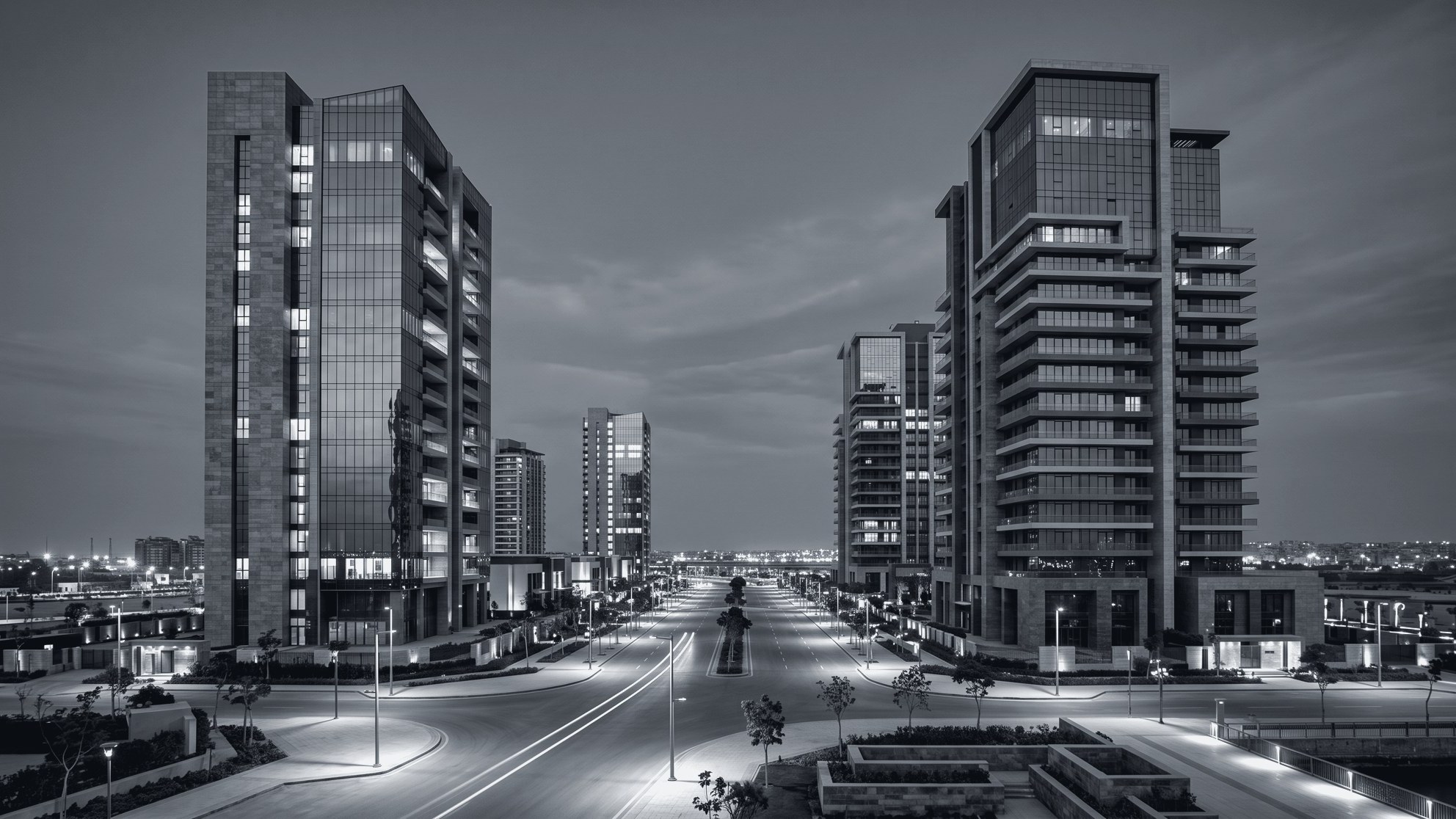 Modern residential towers overlooking a broad avenue at dusk